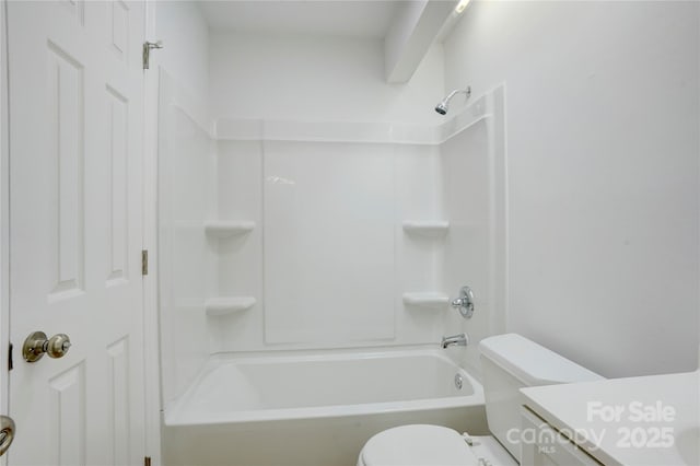 bathroom featuring toilet, shower / washtub combination, and vanity