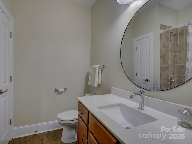 full bath with vanity, wood finished floors, toilet, baseboards, and a shower with curtain