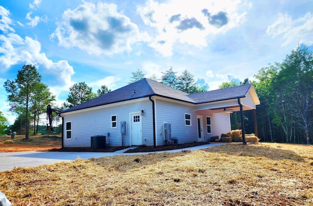1247 Beltline Rd Unit 1, Chester, SC 29706 - back of property with a ceiling fan and roof with shingles