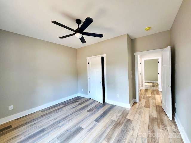 1247 Beltline Rd Unit 1, Chester, SC 29706 - unfurnished bedroom with light wood-style floors, ceiling fan, and a closet