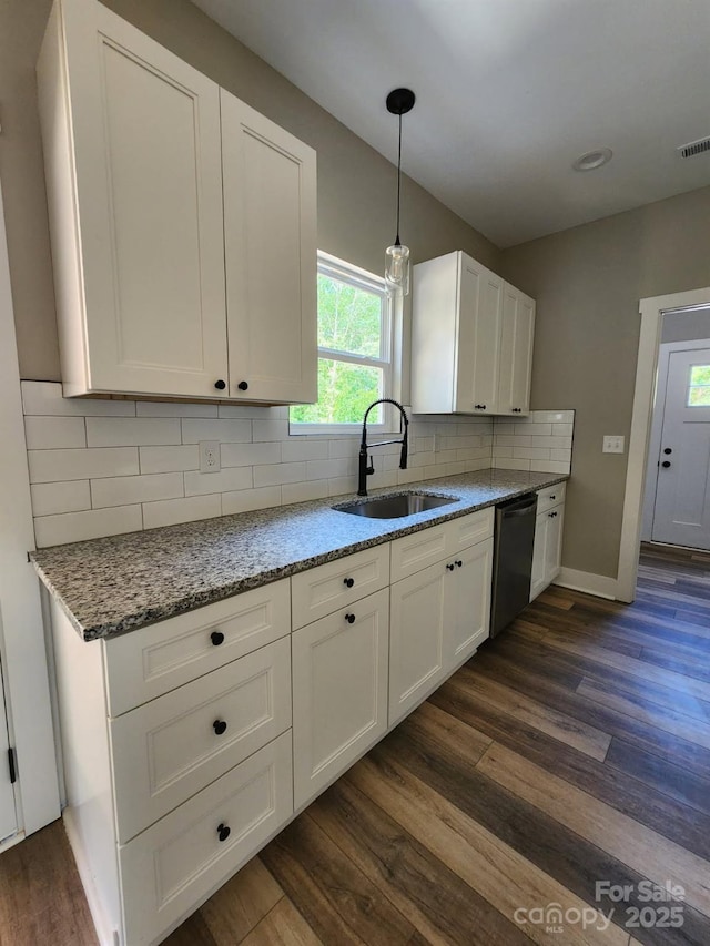 1247 Beltline Rd Unit 1, Chester, SC 29706 - kitchen with dishwasher, dark wood-type flooring, white cabinetry, light stone counters, and tasteful backsplash