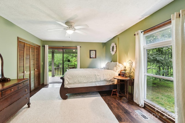 675 Terrys Gap Rd, Hendersonville, NC 28792 - bedroom featuring access to exterior, wood finished floors, a textured ceiling, and ceiling fan