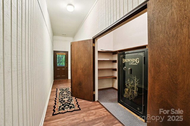675 Terrys Gap Rd, Hendersonville, NC 28792 - hallway featuring wood finished floors, a high ceiling, and baseboards
