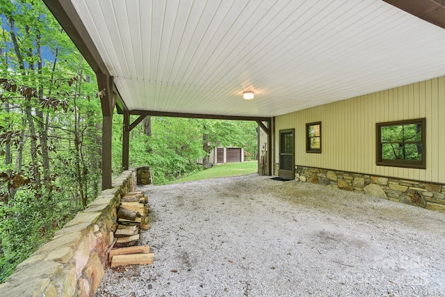 675 Terrys Gap Rd, Hendersonville, NC 28792 - view of patio / terrace with an attached carport and an outbuilding