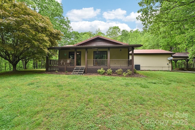 675 Terrys Gap Rd, Hendersonville, NC 28792 - view of front of property with covered porch, a front yard, and central air condition unit