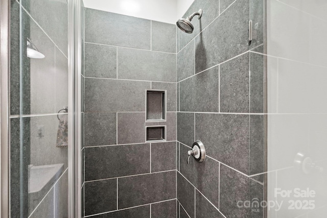 full bath with a shower stall