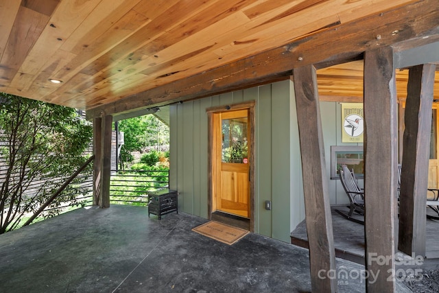 entrance to property featuring board and batten siding