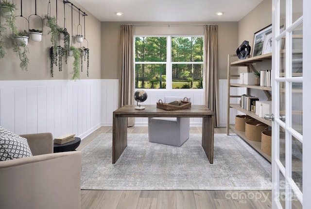 office space with recessed lighting, light wood finished floors, and wainscoting