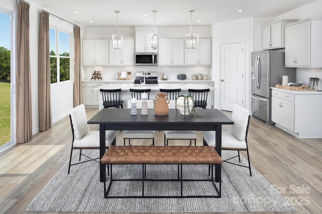 dining room featuring recessed lighting and light wood-style floors