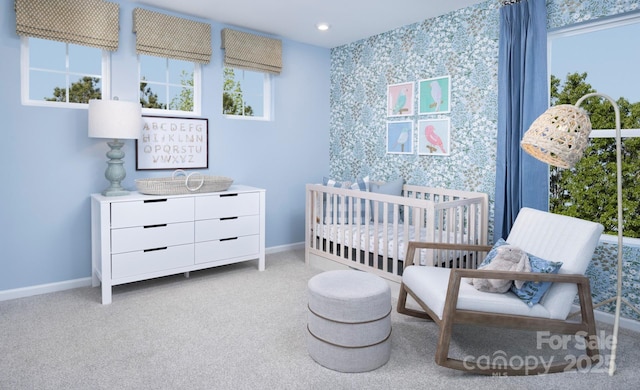 carpeted bedroom with baseboards, multiple windows, and wallpapered walls