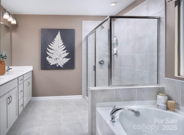 bathroom featuring a garden tub, tile patterned flooring, a shower stall, vanity, and baseboards