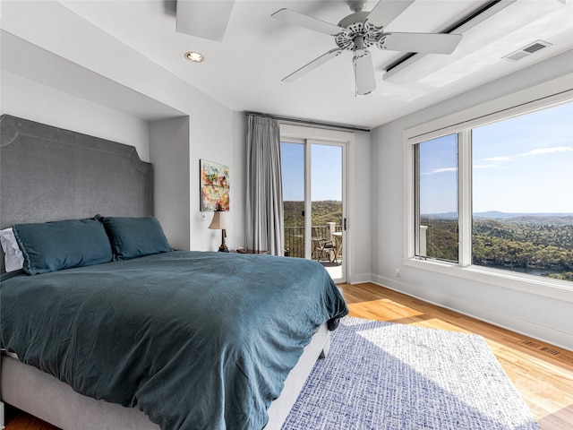 bedroom with access to outside, recessed lighting, visible vents, and light wood-type flooring