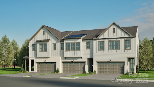 808 Garringer Pl, Charlotte, NC 28208 - townhome / multi-family property with board and batten siding, roof with shingles, and a garage