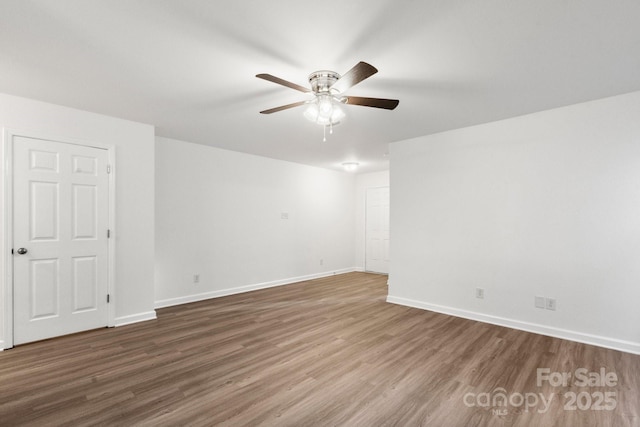 7616 Monarch Birch Ln, Charlotte, NC 28215 - empty room with baseboards, ceiling fan, and wood finished floors