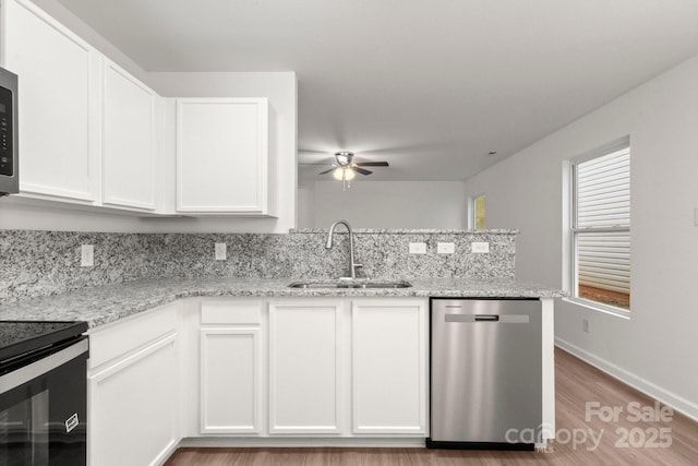 7616 Monarch Birch Ln, Charlotte, NC 28215 - kitchen featuring ceiling fan, a sink, light wood-style floors, dishwasher, and stove