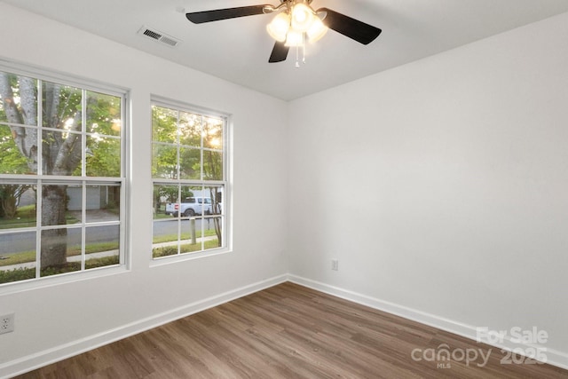 7616 Monarch Birch Ln, Charlotte, NC 28215 - spare room with ceiling fan, baseboards, visible vents, and wood finished floors