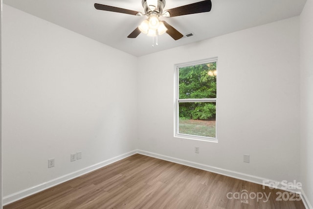 7616 Monarch Birch Ln, Charlotte, NC 28215 - unfurnished room featuring baseboards, ceiling fan, wood finished floors, and visible vents