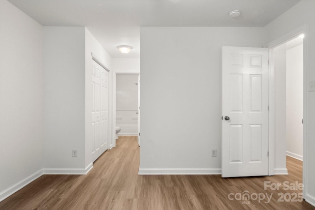 7616 Monarch Birch Ln, Charlotte, NC 28215 - unfurnished bedroom with baseboards and wood finished floors