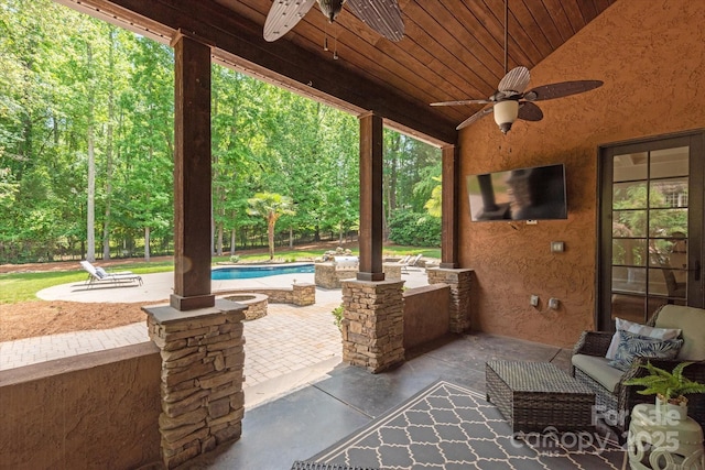 view of patio / terrace featuring an outdoor pool and ceiling fan
