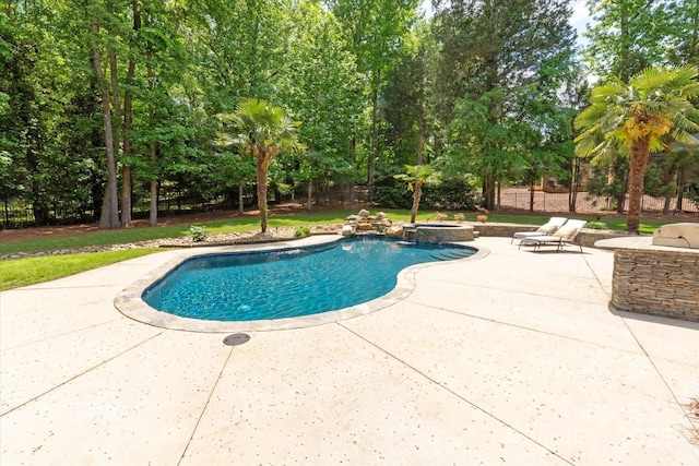view of pool featuring a patio and a pool with connected hot tub