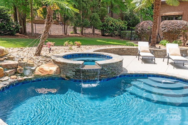 view of pool with an in ground hot tub, fence, a fenced in pool, and a patio area