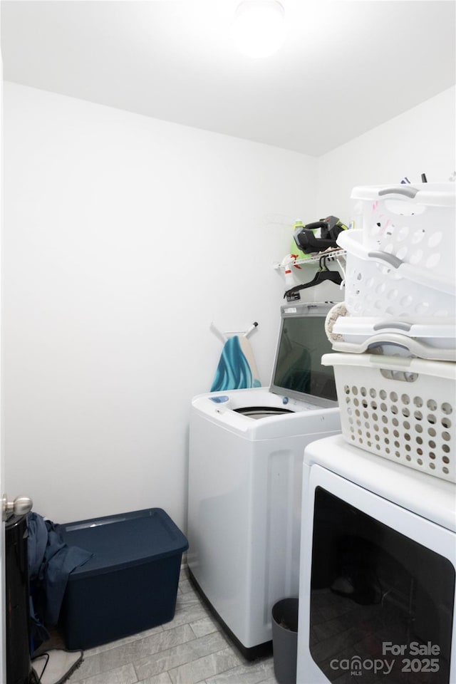 217 Hydrangea Dr, Clover, SC 29710 - clothes washing area with laundry area and washing machine and dryer