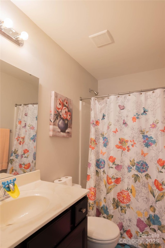 217 Hydrangea Dr, Clover, SC 29710 - bathroom with visible vents, curtained shower, toilet, and vanity