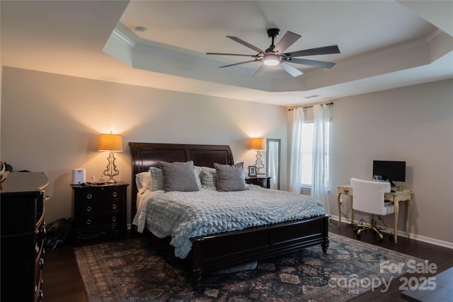 217 Hydrangea Dr, Clover, SC 29710 - bedroom featuring dark wood-style flooring, a tray ceiling, and ornamental molding