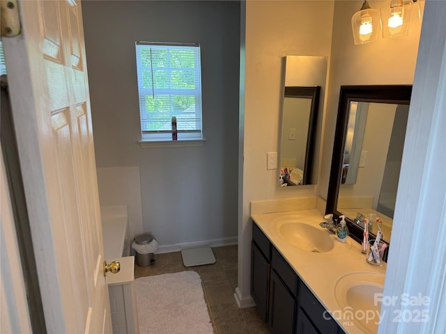 12244 Wallace Ridge Dr, Charlotte, NC 28269 - full bathroom with tile patterned flooring, double vanity, baseboards, a bathtub, and a sink