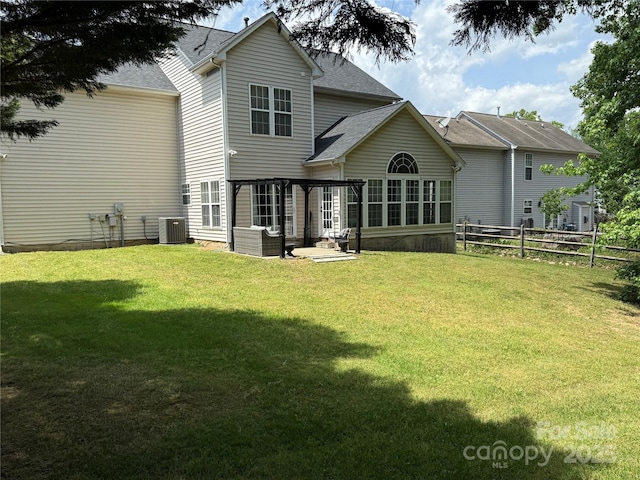 12244 Wallace Ridge Dr, Charlotte, NC 28269 - back of property with a lawn, a patio, fence, and cooling unit
