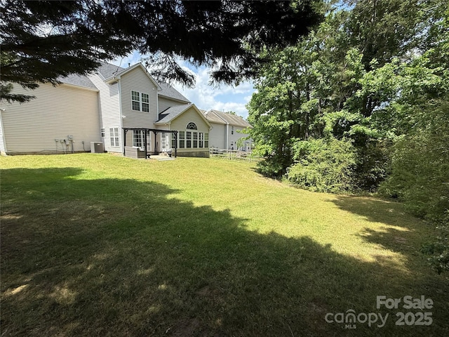 12244 Wallace Ridge Dr, Charlotte, NC 28269 - rear view of property featuring a yard, fence, and cooling unit