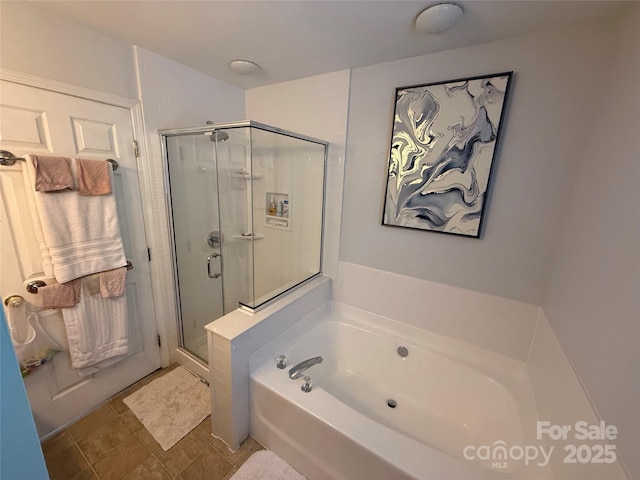 12244 Wallace Ridge Dr, Charlotte, NC 28269 - bathroom featuring a garden tub, tile patterned floors, and a stall shower
