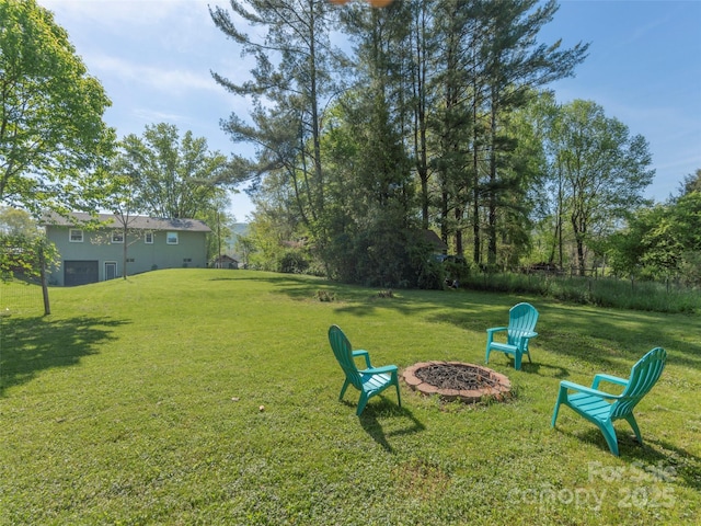 view of yard featuring a fire pit