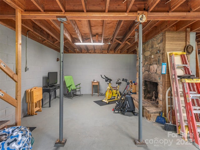unfinished basement with concrete block wall