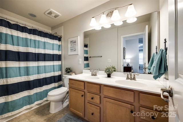 full bath featuring visible vents, a sink, tile patterned floors, and double vanity