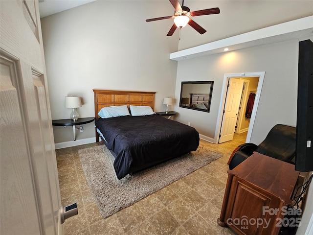 bedroom with baseboards, ceiling fan, and high vaulted ceiling