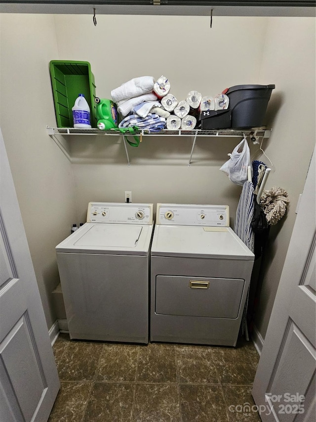 laundry area featuring baseboards, laundry area, and independent washer and dryer