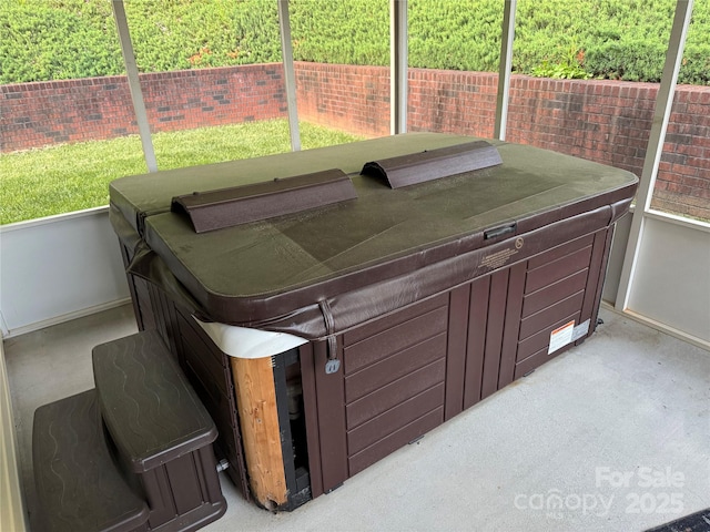 exterior space with a hot tub