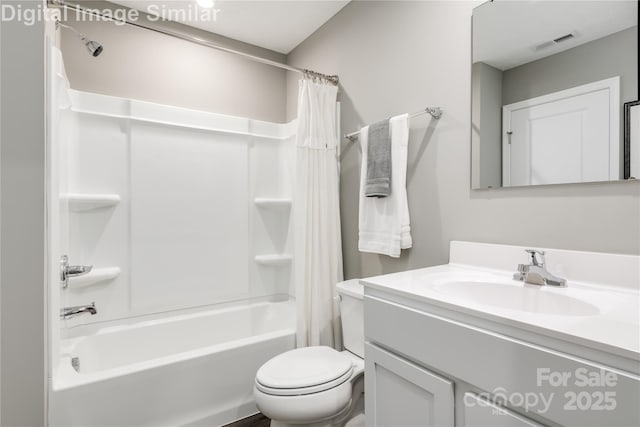 bathroom with visible vents, shower / bath combo with shower curtain, toilet, and vanity