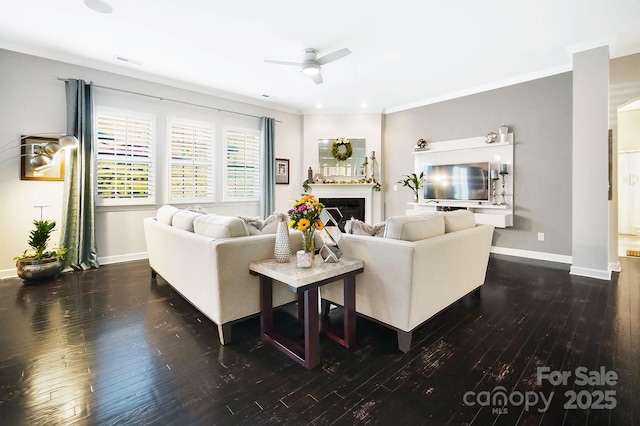 living area featuring baseboards, a fireplace, ceiling fan, and hardwood / wood-style flooring