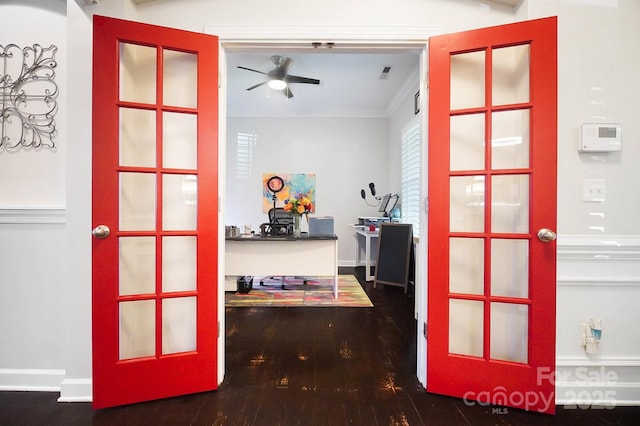 hall featuring crown molding, visible vents, and wood finished floors