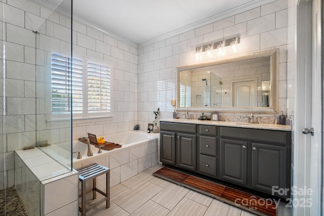 full bathroom featuring crown molding, tiled shower, a sink, and a bath