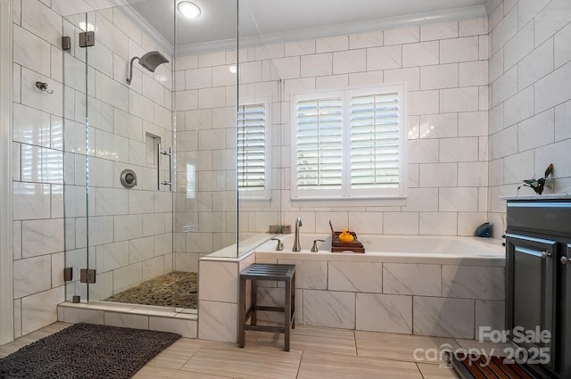 full bath featuring tile walls, ornamental molding, a bath, a shower stall, and tile patterned flooring