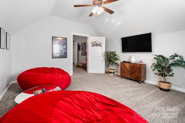 carpeted bedroom featuring lofted ceiling, baseboards, and a ceiling fan