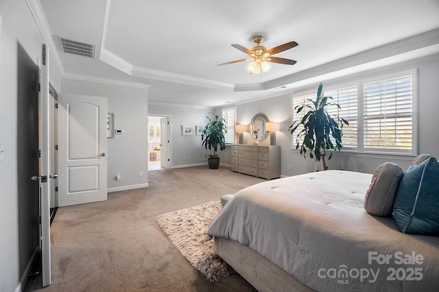 bedroom with a raised ceiling, carpet flooring, crown molding, baseboards, and ceiling fan
