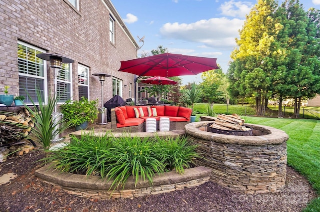 view of yard featuring an outdoor fire pit and a patio area