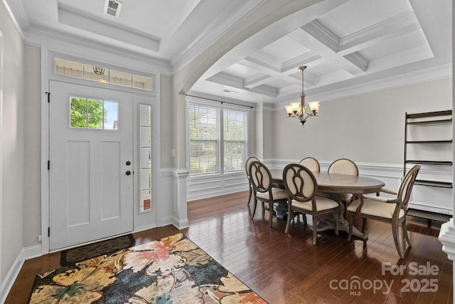 1004 Craven St, Indian Trail, NC 28079 - foyer entrance featuring plenty of natural light, dark wood-type flooring, beam ceiling, a chandelier, and wainscoting