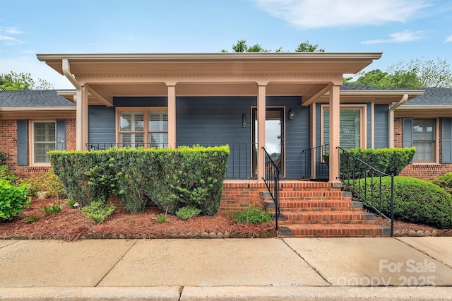 view of front of house featuring brick siding
