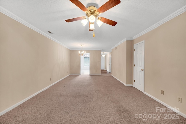 unfurnished room with carpet flooring, crown molding, ceiling fan with notable chandelier, baseboards, and visible vents