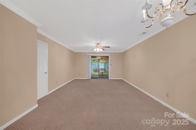 spare room with visible vents, carpet floors, baseboards, ceiling fan with notable chandelier, and ornamental molding